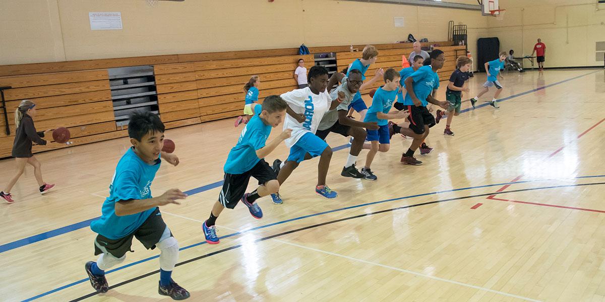 Image of kids running in the gym